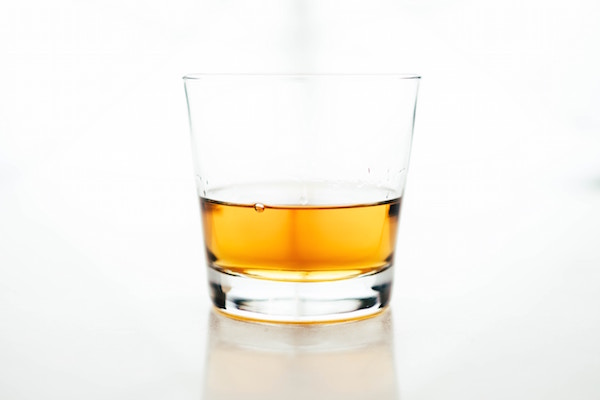 Whisky glass on white background